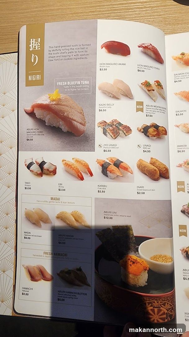 Hand-pressed sushi formed by rolling rice and topping with sashimi or cooked ingredients.