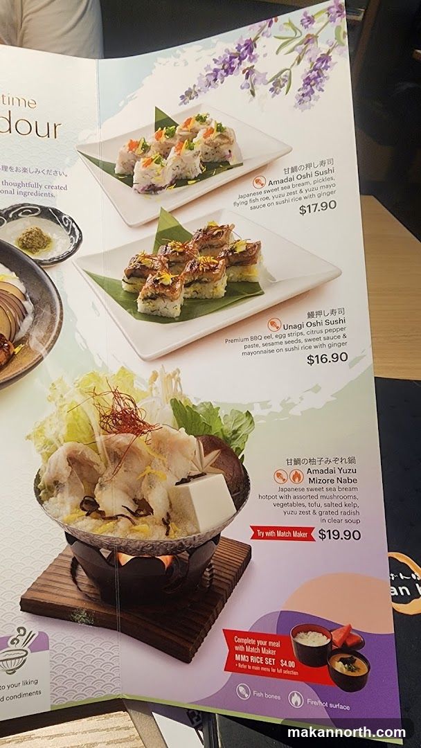 A menu featuring various Japanese dishes including sushi and hot pot.