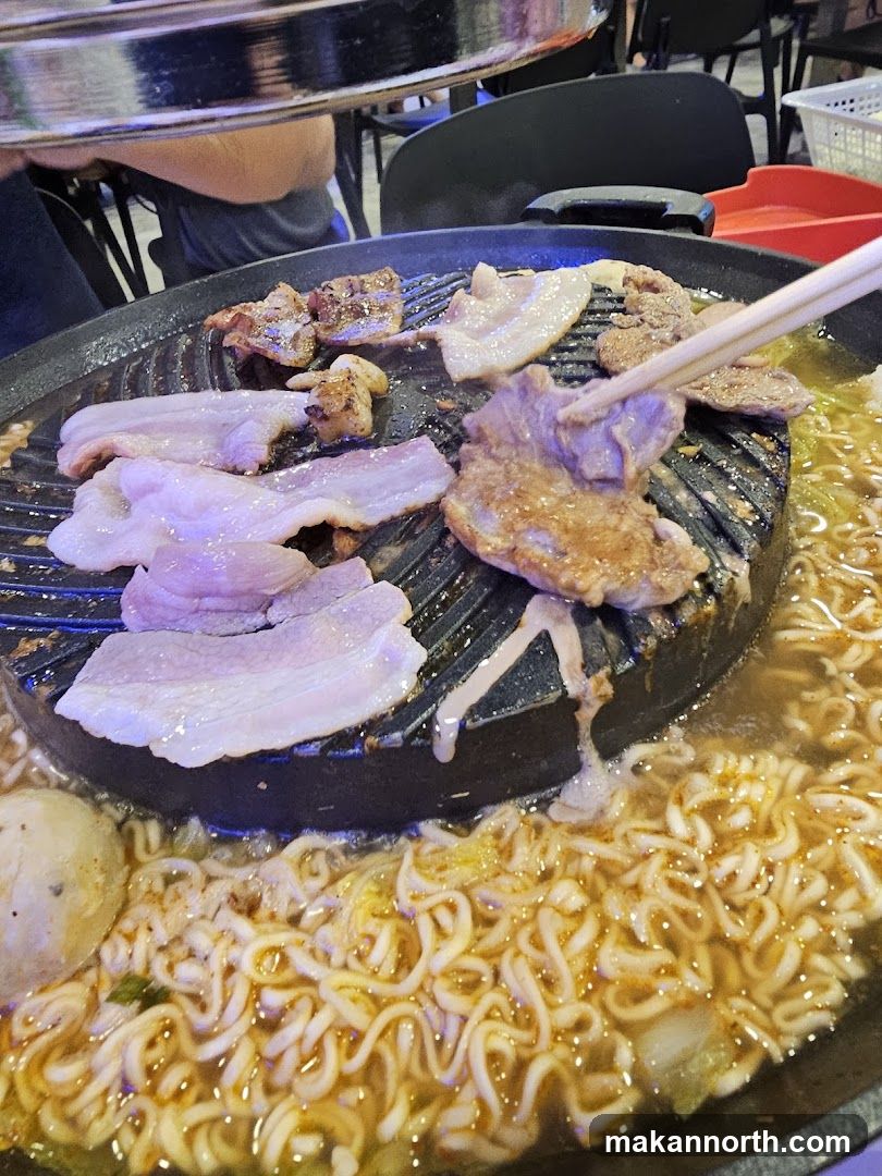 Grilling Meat and Noodles