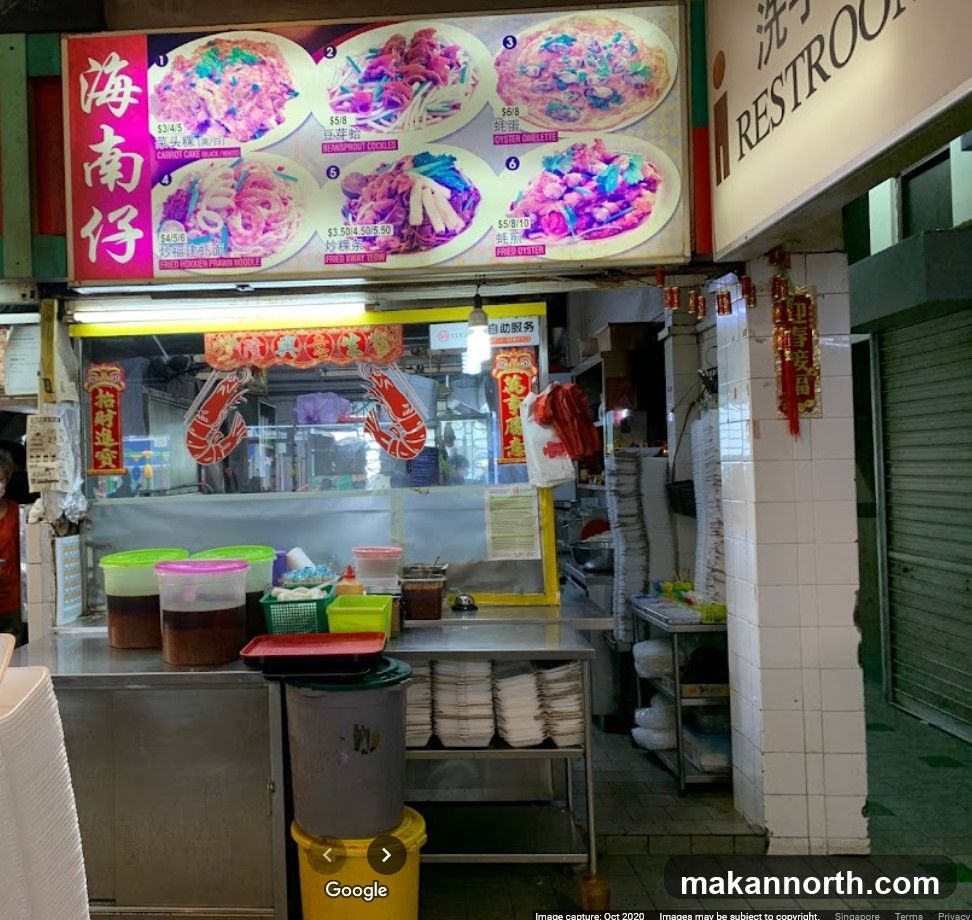 Food stall with menu and seating area