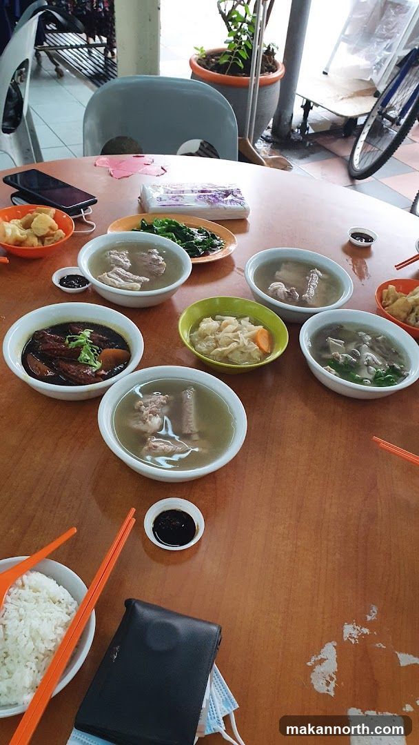Table with bowls of soup and rice