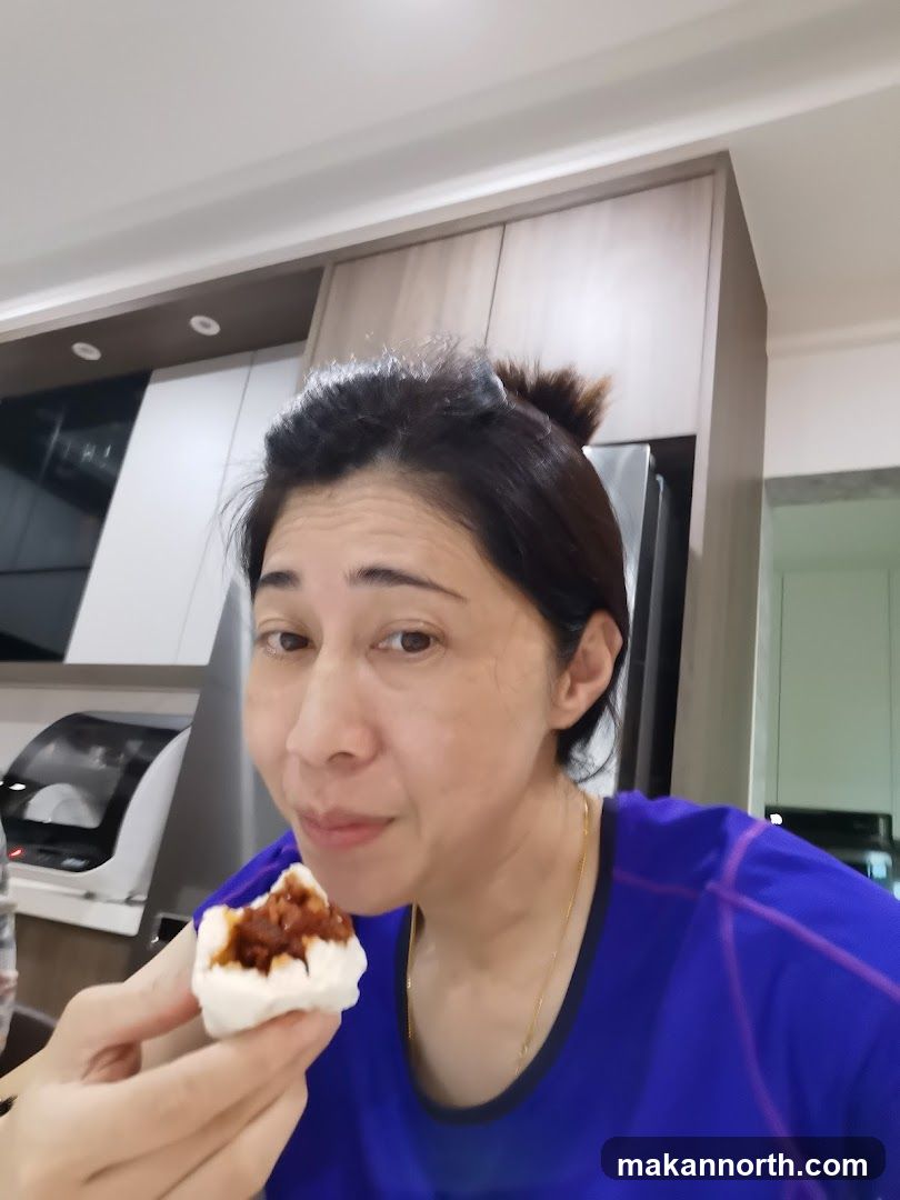 Woman eating a bun