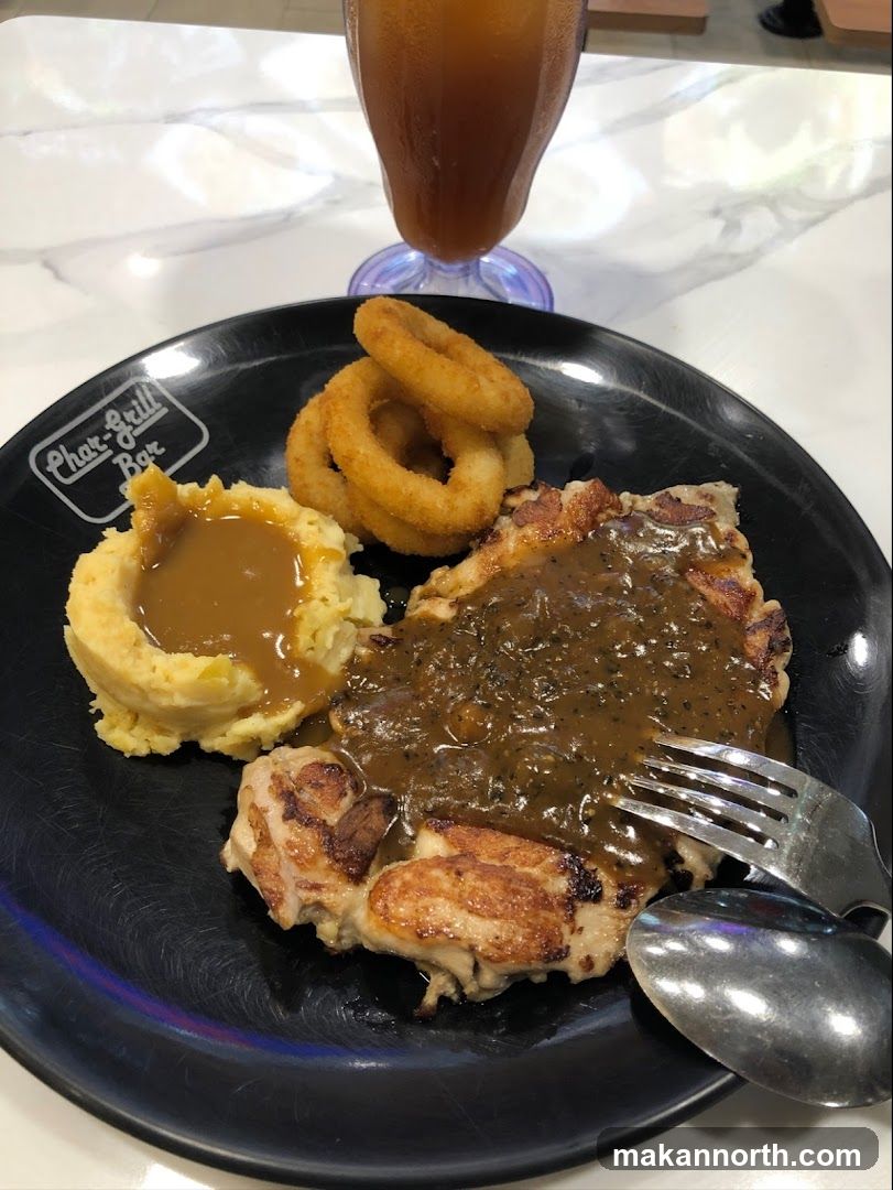 Chicken steak with mashed potatoes and onion rings
