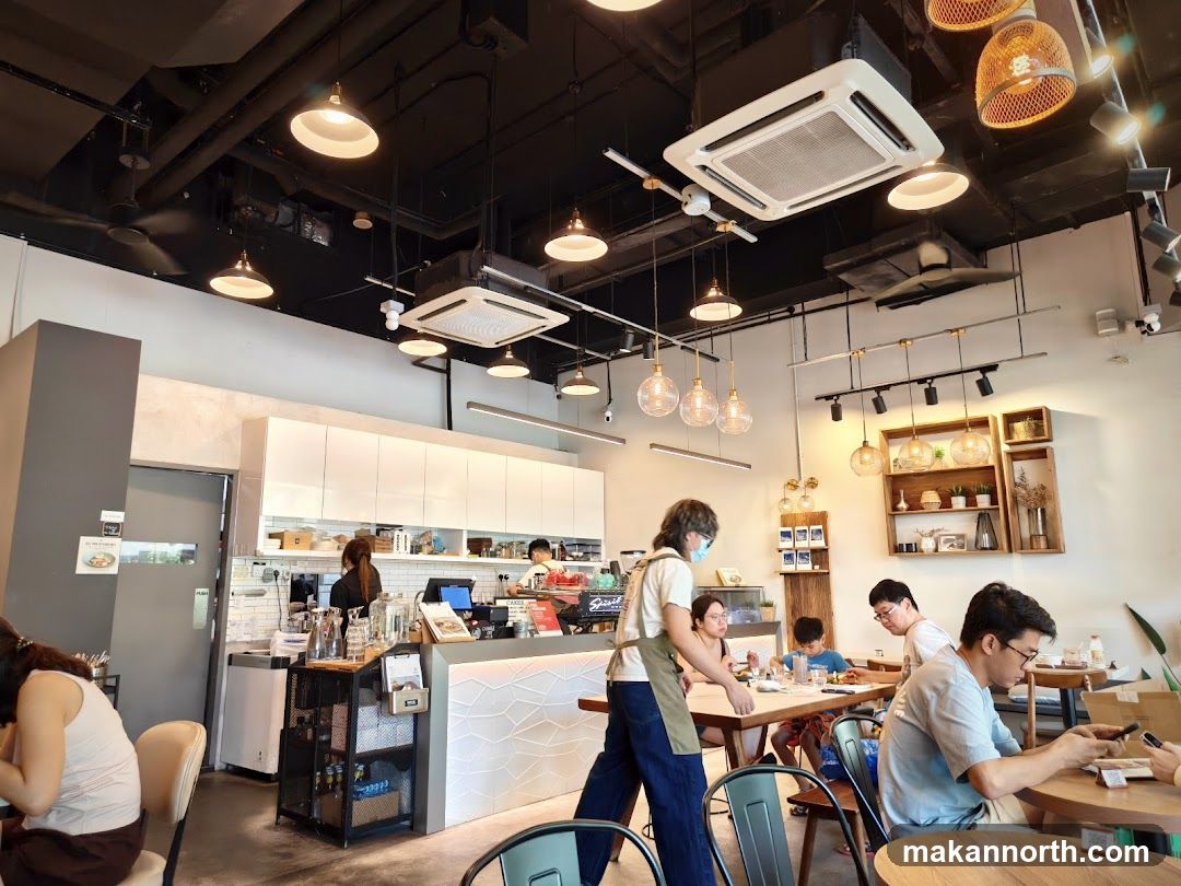 Interior of a cafe with customers and staff