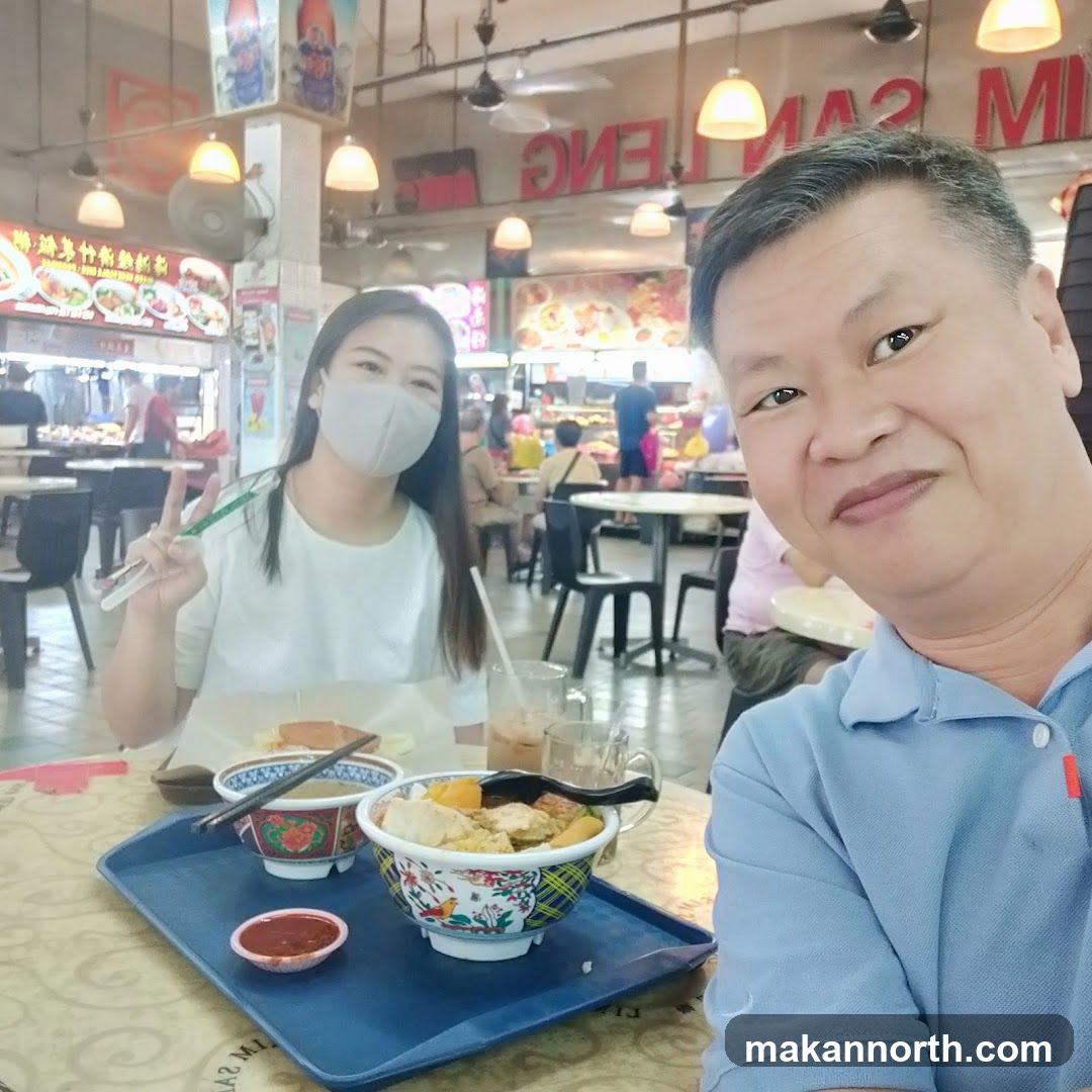 Couple enjoying a meal at a food court