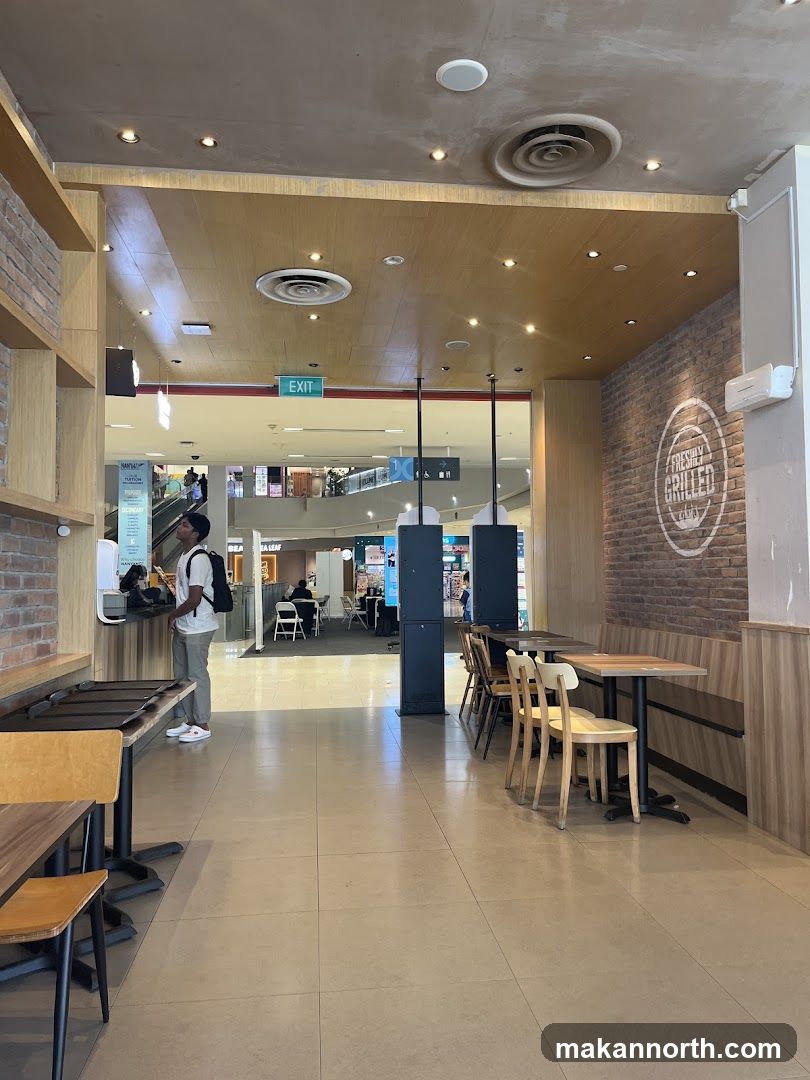 Restaurant Interior with Seating and Mall View