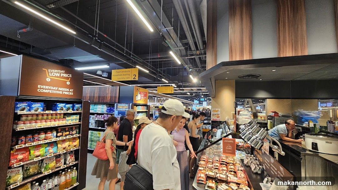 Supermarket aisle with various products and shoppers