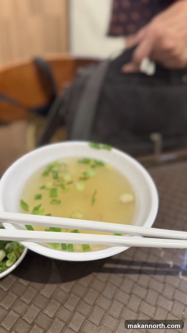 Bowl of Soup with Chopsticks