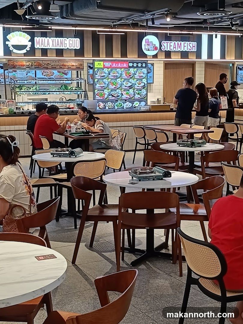 Food court with dining tables and food stalls