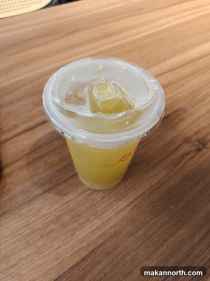 Yellow Drink in a Plastic Cup