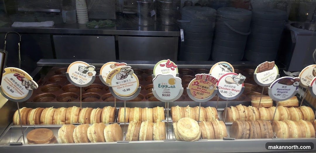Food display with various egg-shaped pastries