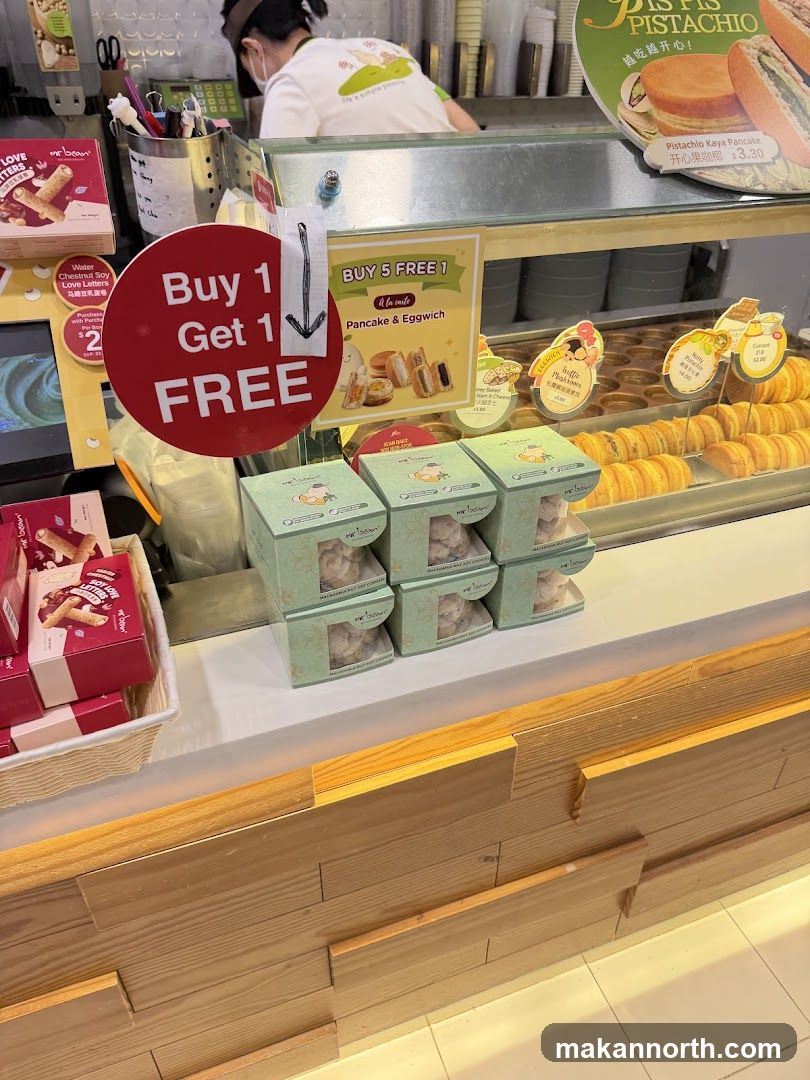 Food stall with promotional signs