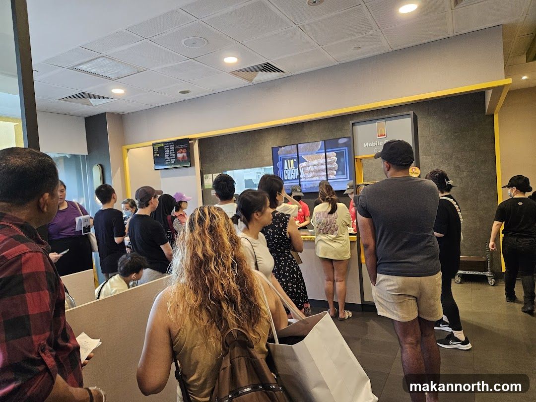 People Waiting in Line at a Fast Food Restaurant