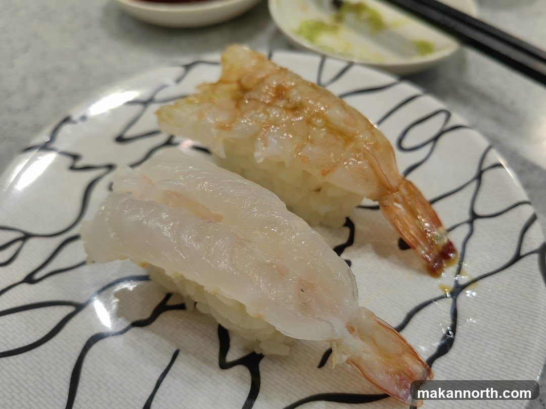 Two pieces of sushi on a plate