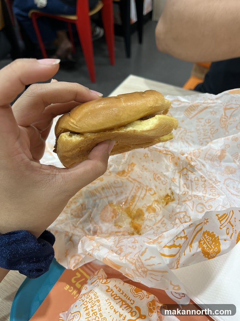 Hand holding a sandwich