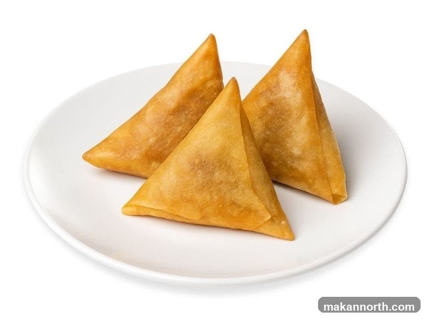 Three Samosas on a Plate