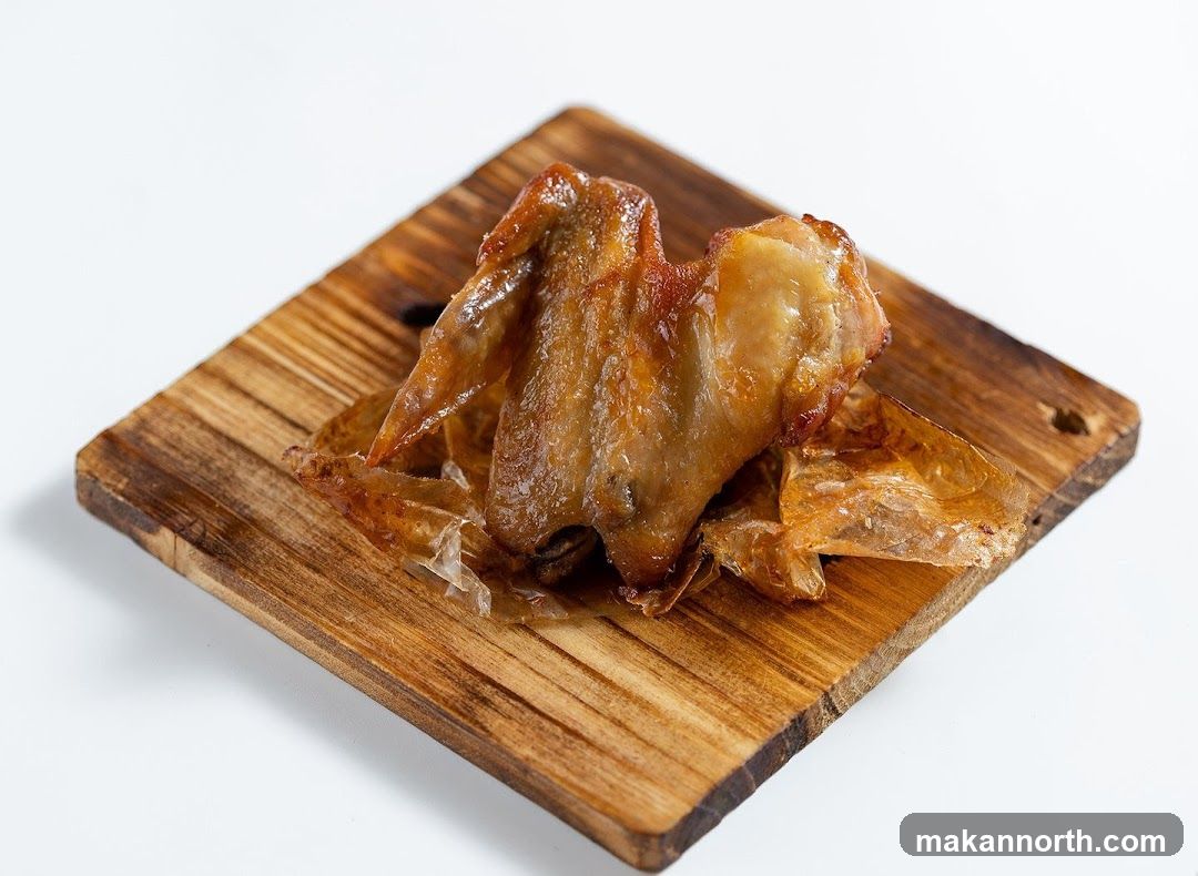 Crispy Chicken Wing on Wooden Board