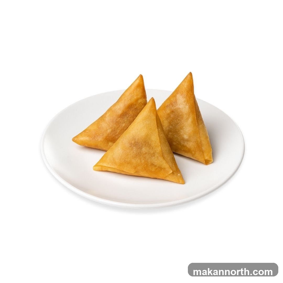 Three Samosas on a Plate