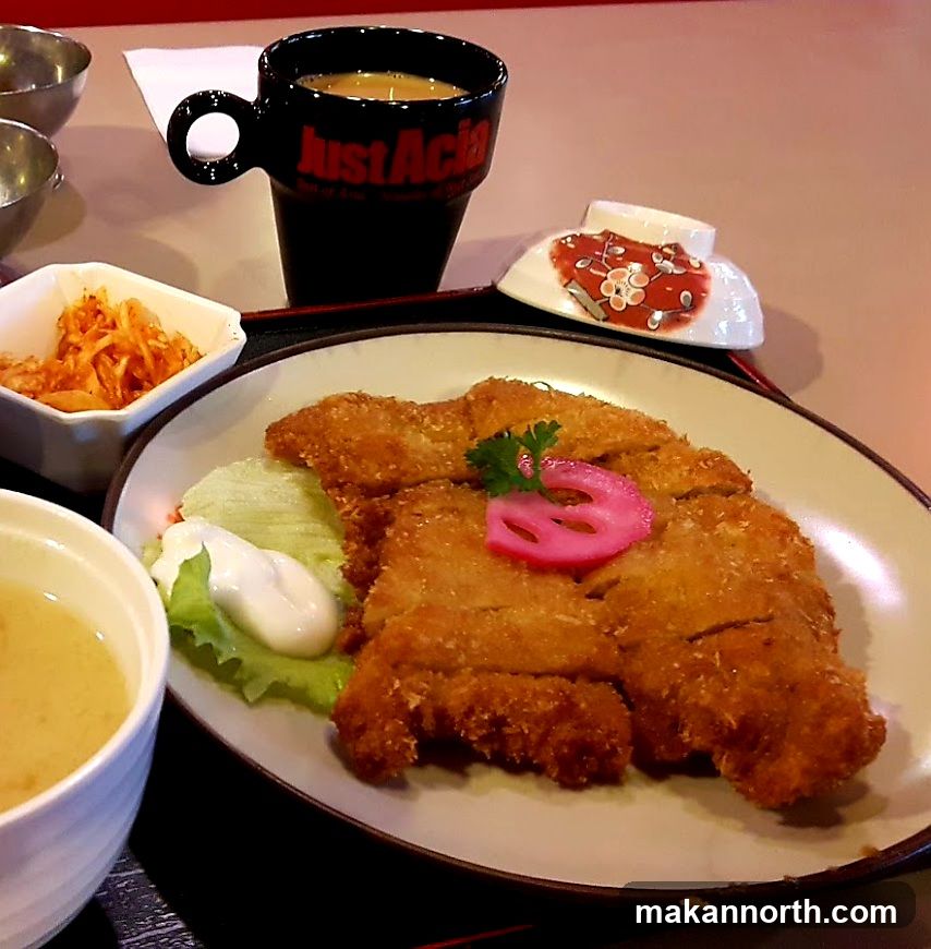 Fried cutlet with sides and drink