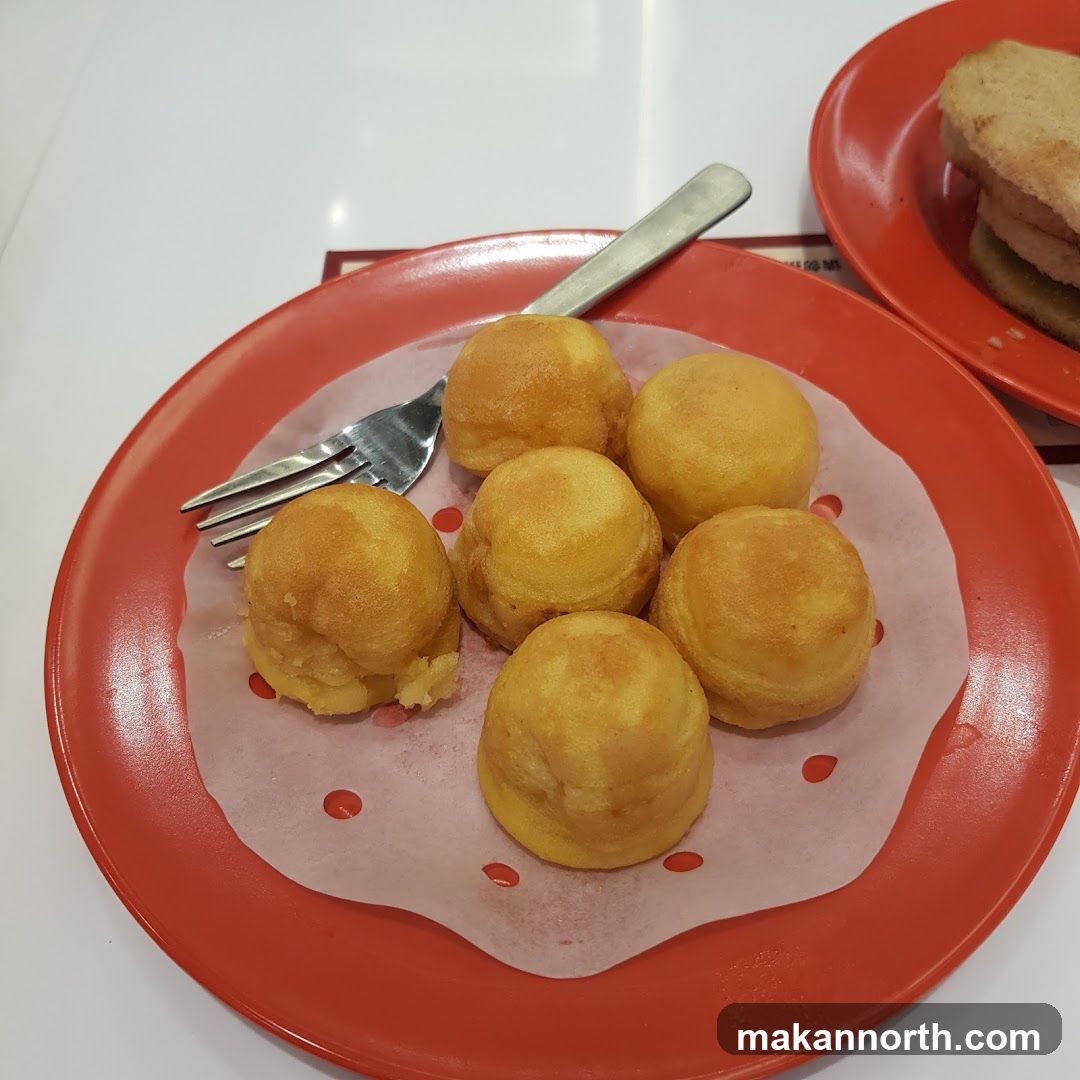 Golden Puffs on a Red Plate