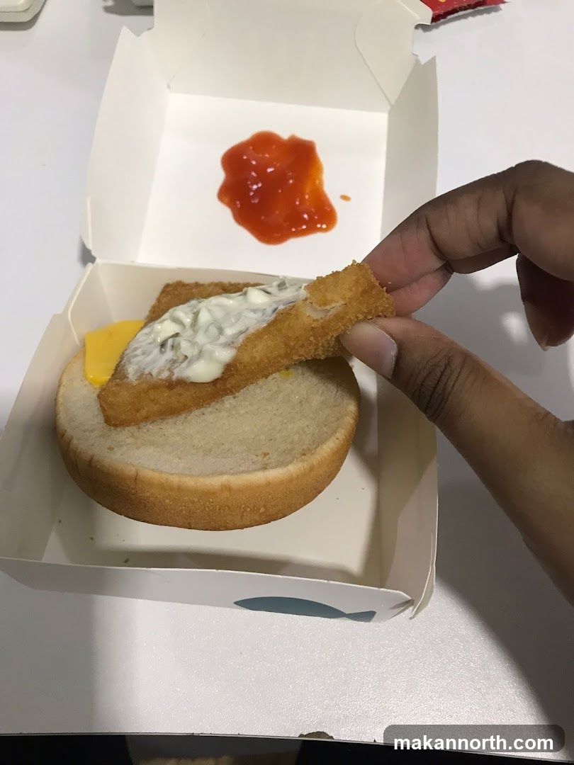 Fish Sandwich Being Assembled