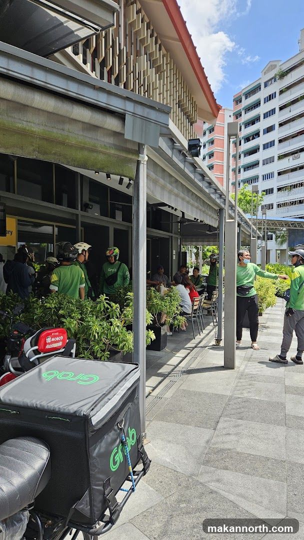 Outdoor seating area with delivery personnel