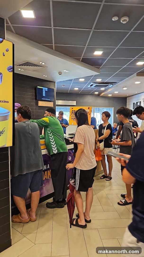 People queuing at a fast food counter