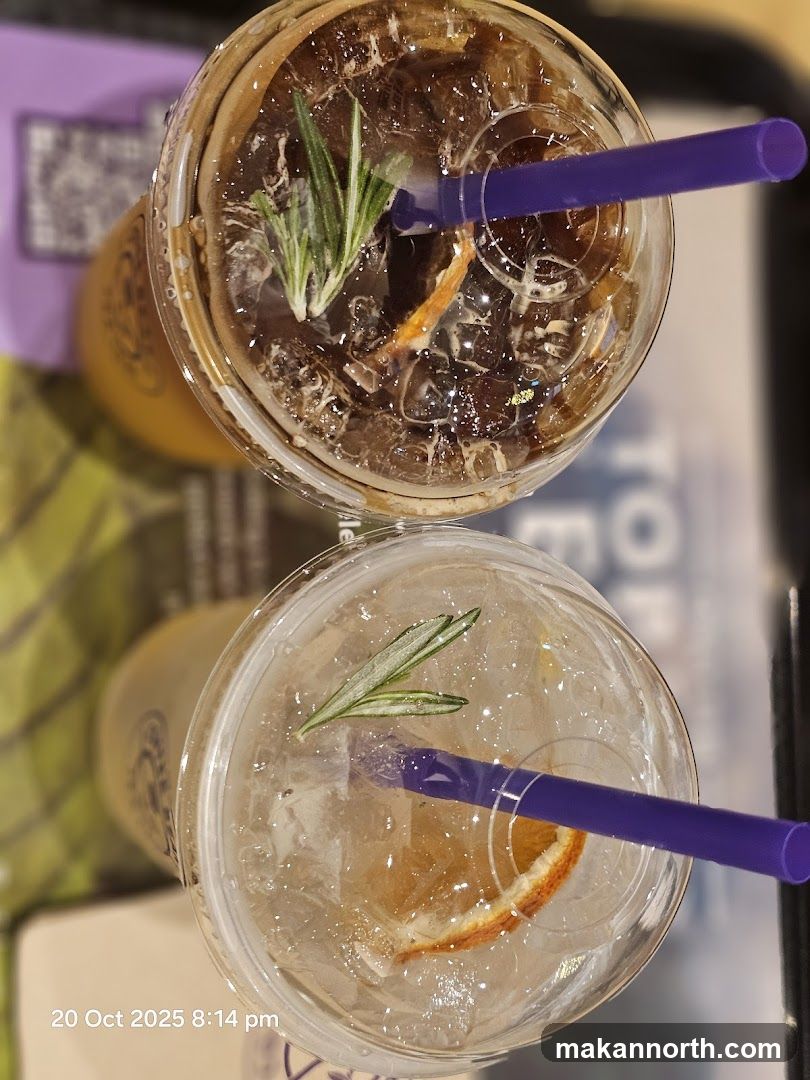 Two drinks with garnishes