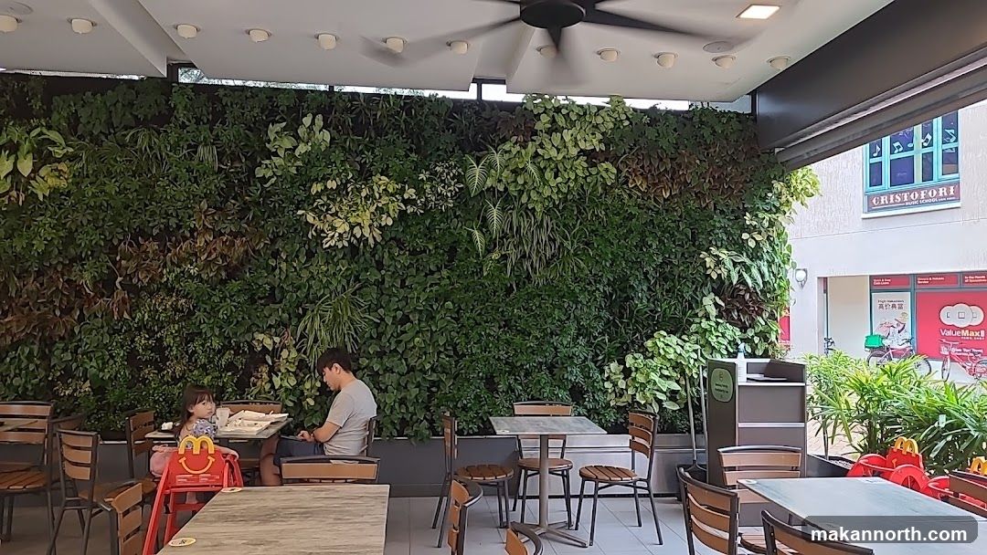 Outdoor seating area with a living wall