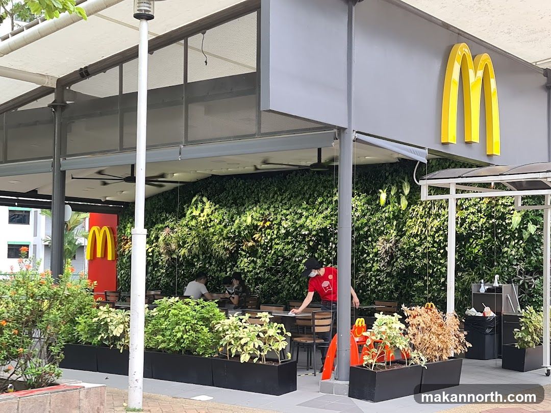 McDonald's storefront with green wall