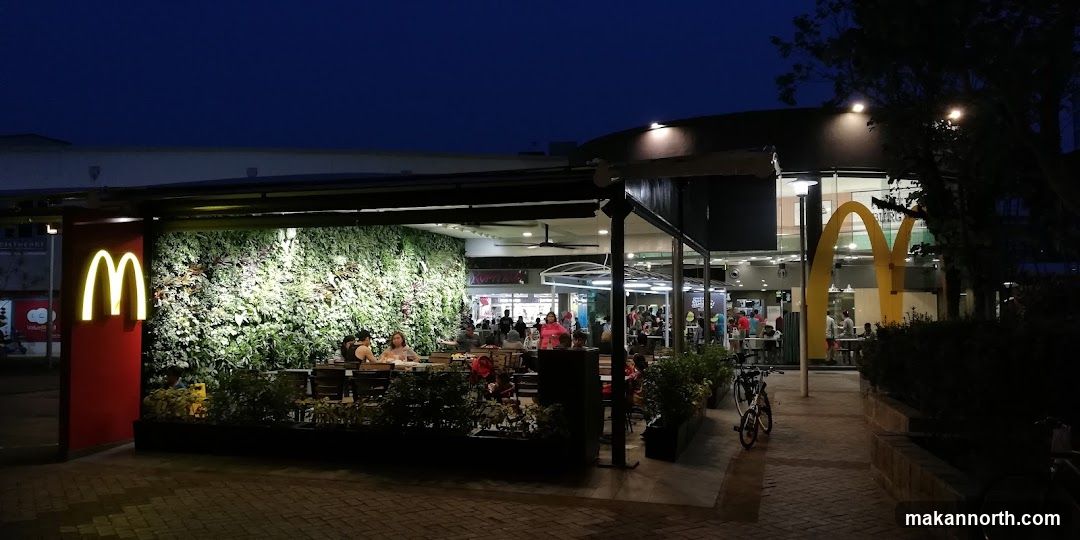 McDonald's storefront with green wall