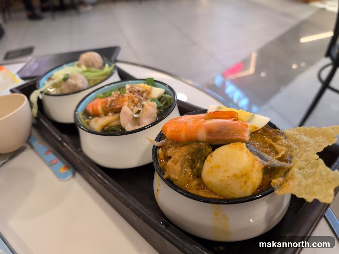 Three bowls of noodles with toppings