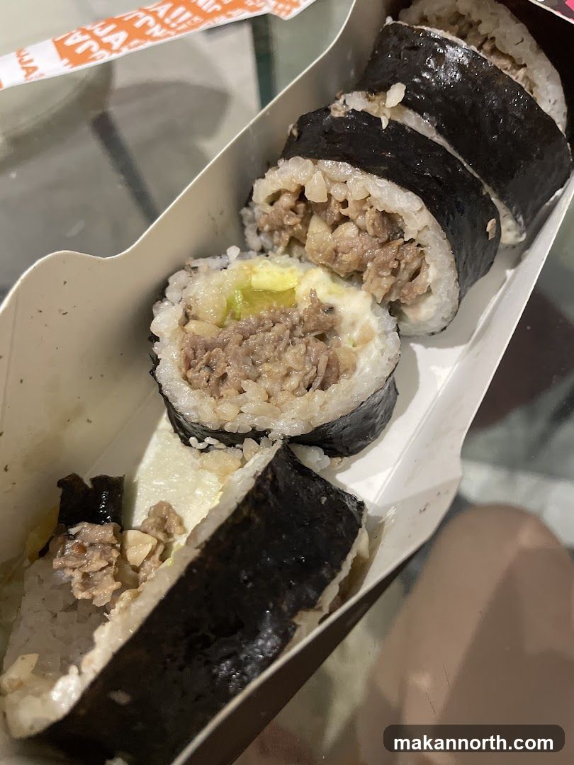 Sushi Rolls in a Takeout Box