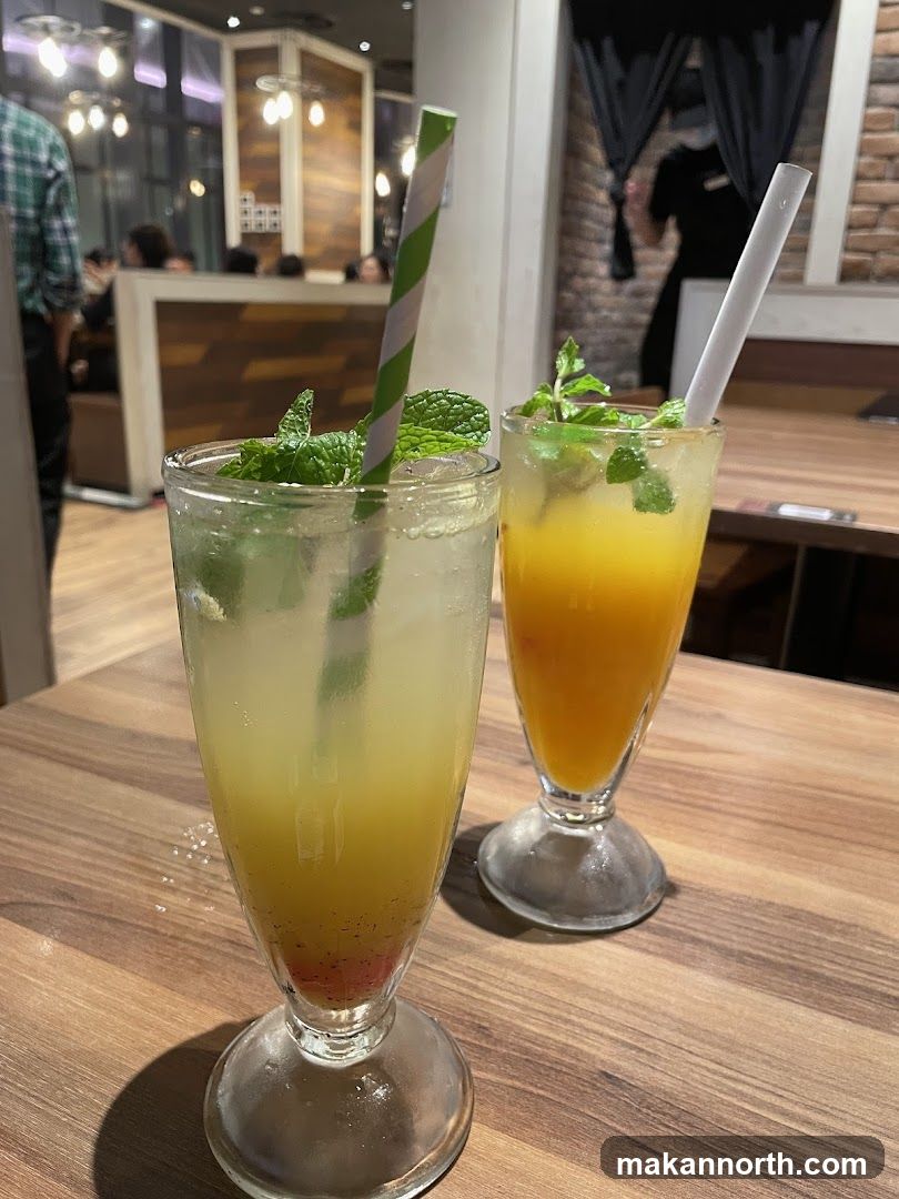 Two refreshing drinks on a wooden table