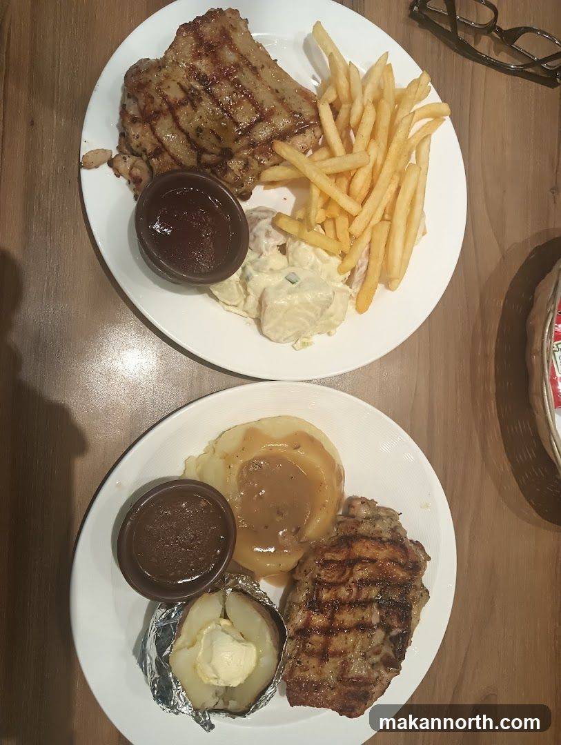 Two plates of grilled meat with sides