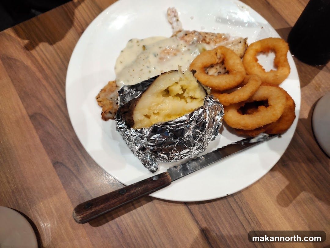 Steak Dinner with Baked Potato and Onion Rings