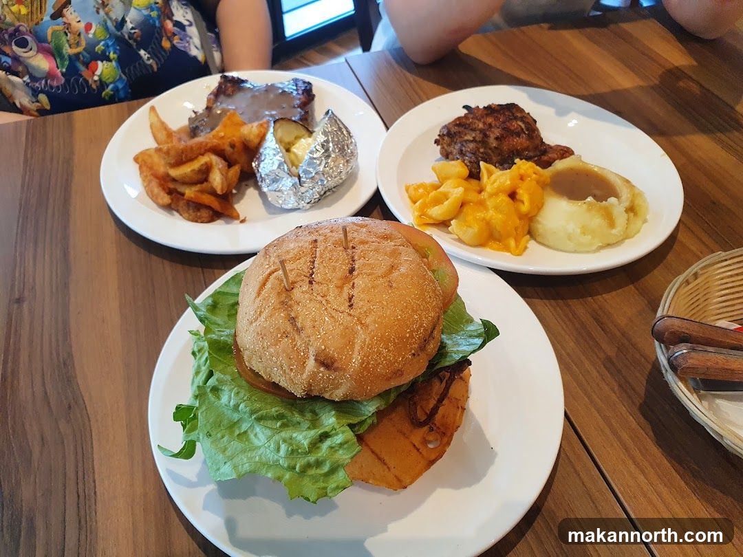 Three Plates of Food on a Wooden Table
