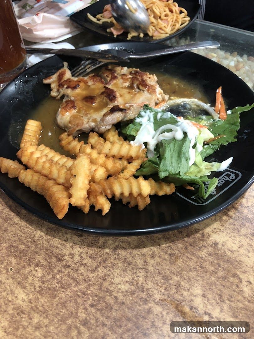 Chicken steak with fries and salad