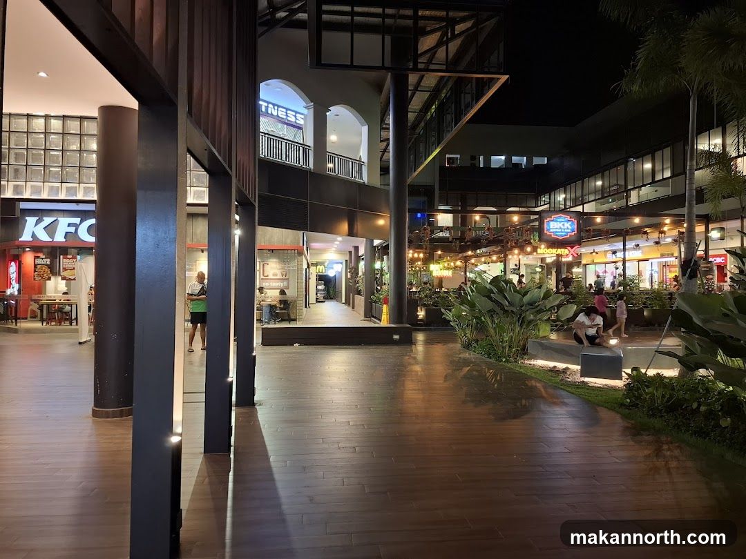 Outdoor shopping area at night
