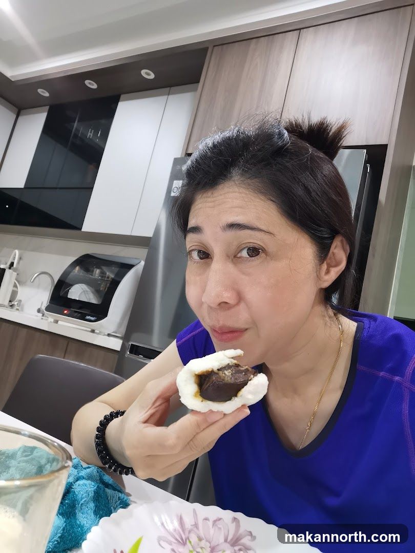 Woman eating a bun