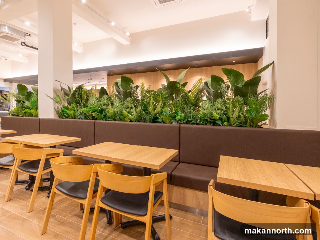Modern Cafe Interior with Lush Greenery