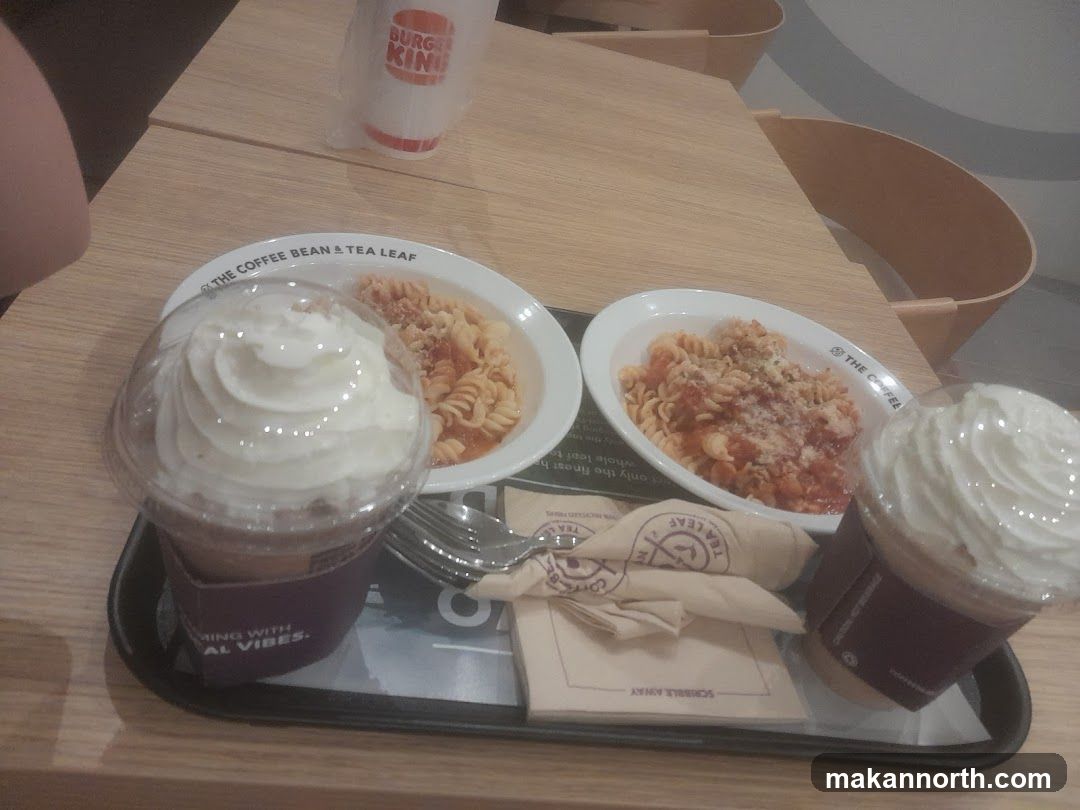 Two pasta dishes and two iced drinks