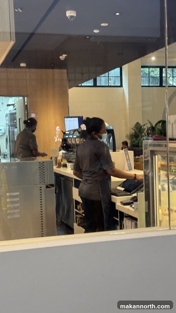 Baristas working behind a counter