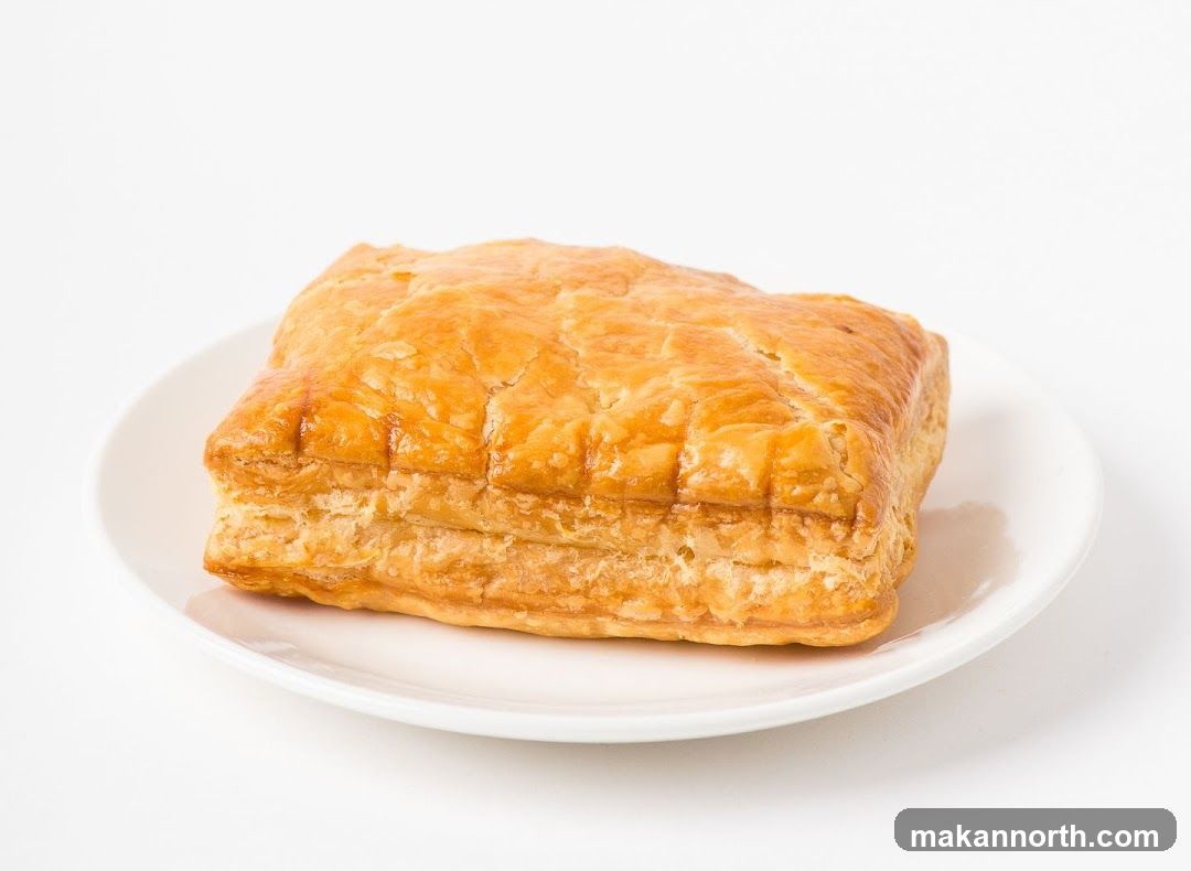 Golden Puff Pastry on a White Plate