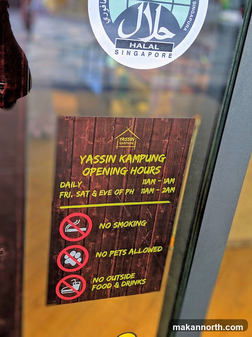 Yassin Kampung Opening Hours Sign