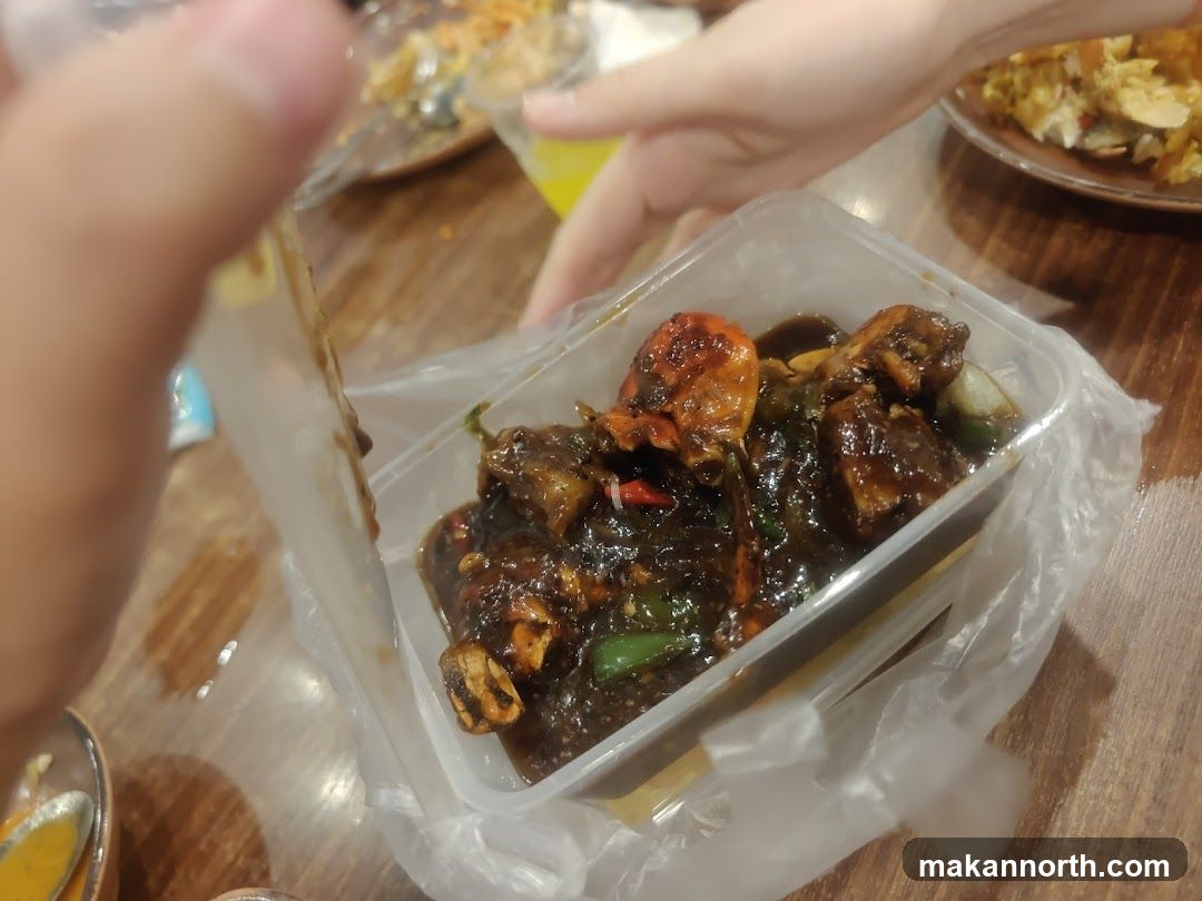 Crab dish in takeout container