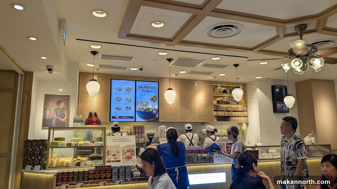Interior of a cafe with food displays and staff