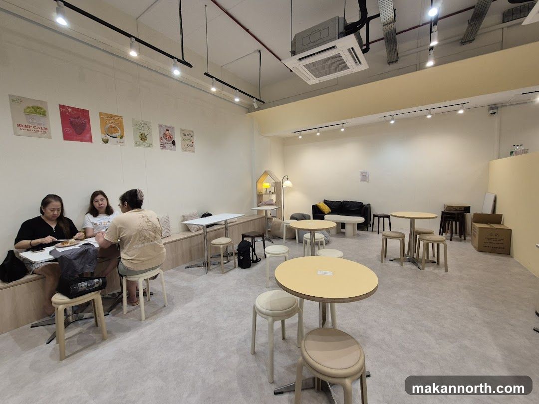 Cafe Interior with Seating and Posters