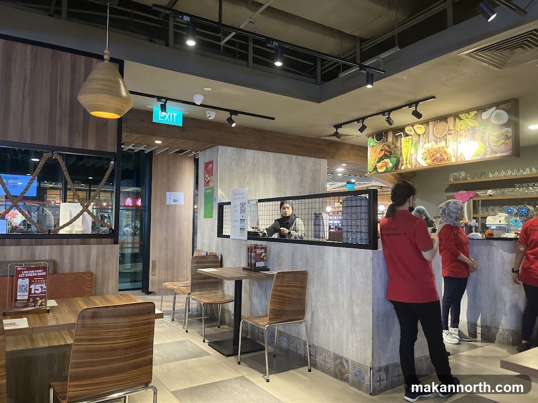 Restaurant Interior with Staff and Food Display