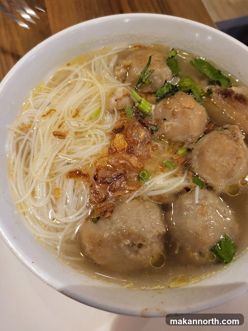 Bowl of Noodle Soup with Meatballs